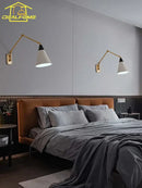 Gold lustre brass swing arm wall lamp for bedroom with white shade