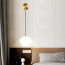 Gold opal glass spherical wall light fixture for bedroom