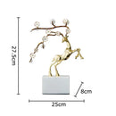 Golden deer antlers statue with white blossoms living room decor