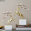 Golden deer antlers statue with white blossoms living room decor