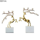 Golden deer antlers statue with white blossoms living room decor