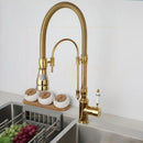 Golden kitchen faucet with white ceramic handle and swivel spout
