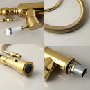 Golden kitchen faucet with white ceramic handle and swivel spout