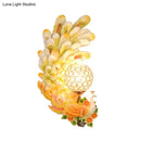 Golden peacock wall light with crystal shade – living room yellow & green