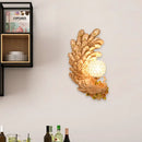 Golden peacock wall light with crystal shade – living room yellow & green