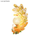Golden peacock wall light with crystal shade – living room yellow & green