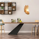 Golden peacock wall light with crystal shade – living room yellow & green
