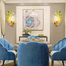 Golden peacock wall light with crystal shade – living room yellow & green