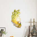 Golden peacock wall light with crystal shade – living room yellow & green