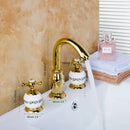 Golden plated bathroom faucet set with white ceramic handles