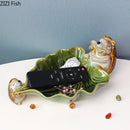 Green ceramic leaf decor tray with porcupines for dining room storage