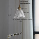Green glass pendant light with copper canopy for dining room