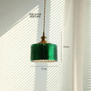 Green glass pendant light with copper canopy for dining room