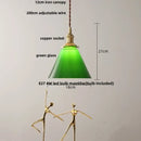 Green glass pendant light with copper canopy for dining room