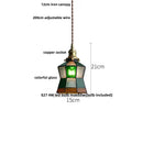 Green glass pendant light with copper canopy for dining room