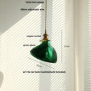 Green glass pendant light with copper canopy for dining room