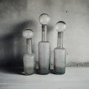 Grey round glass vase set with hammer lid stoppers living room