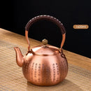 Handmade hammered copper tea pot with knitting handle dining room set