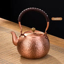 Handmade hammered copper tea pot with knitting handle dining room set