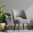 Geometric Wallpaper with a Repeating Starburst Motif in Black and White - B252