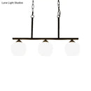 Industrial black 3-light opal glass globe pendant – dining room