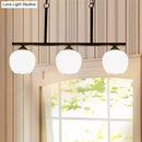 Industrial black 3-light opal glass globe pendant – dining room