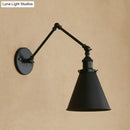 Industrial black & rust cone wall sconce – bedroom articulated light