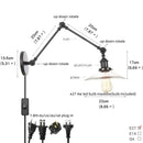 Industrial black swing arm wall light fixture with faceted glass shade
