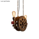 Industrial brass gear pendant light dining room with red accents
