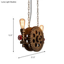 Industrial brass gear pendant light dining room with red accents