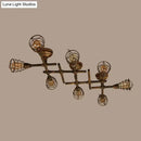 Industrial brass intersecting piping ceiling light dining room cage