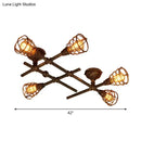 Industrial brass intersecting piping ceiling light dining room cage