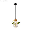 Industrial glass and wood pendant light kit with exposed bulb dining room