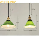 Industrial green glass pendant light dining room with brass accents
