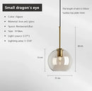 Industrial smoked glass and brass pendant light – dining room
