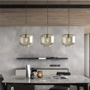 Industrial smoked glass and brass pendant light – dining room