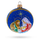 Joseph and Mary Admiring Baby Jesus Glass Ball Christmas Ornament 3.25 Inches