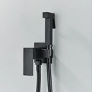 Matte black brass bidet faucet with handheld spray for bathroom