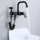Matte black kitchen mixer tap with integrated handheld showerhead