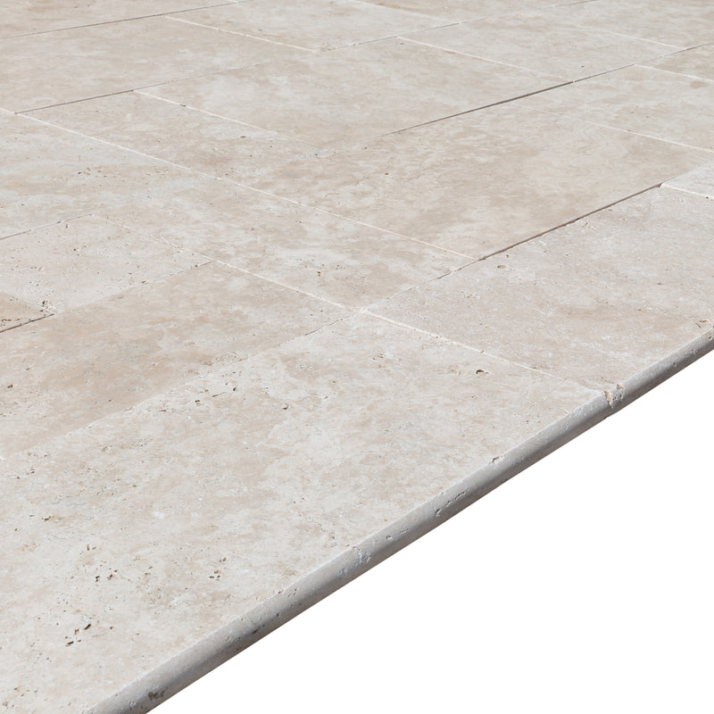 miletos ivory travertine coping 12x24 tumbled angle wide view