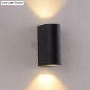 Minimalist black aluminum outdoor cylinder wall light outdoor space