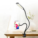 Minimalist black flexible arm desk lamp with phone holder bedroom
