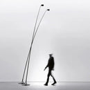 Minimalist black floor lamp with curved led arms for living room