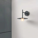 Minimalist black flying saucer wall lamp for bedroom decor