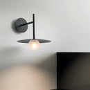 Minimalist black flying saucer wall lamp for bedroom decor