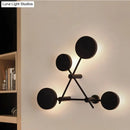 Minimalist black geometric wall light fixture for living room