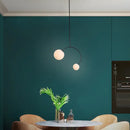 Minimalist black glass ball pendant lights – dining room curved arm