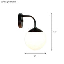 Minimalist black & gold wall light with milky glass ball for bedroom