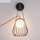 DecorBites™ Minimalist Black LED Wall Sconce with Leather Handle - Pear Cage Iron Design