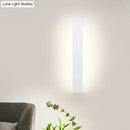 Minimalist black & white aluminum shade direct wired sconce bedroom
